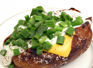 Huge Loaded Baked Potato with Many Calories